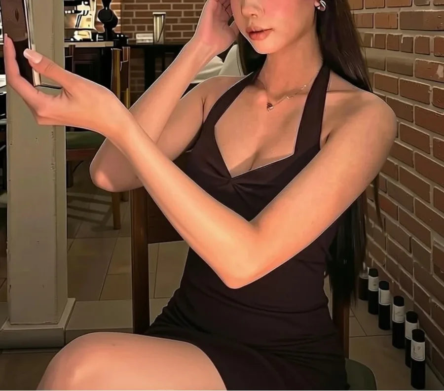 Brown halter dress with cleavage on a night out