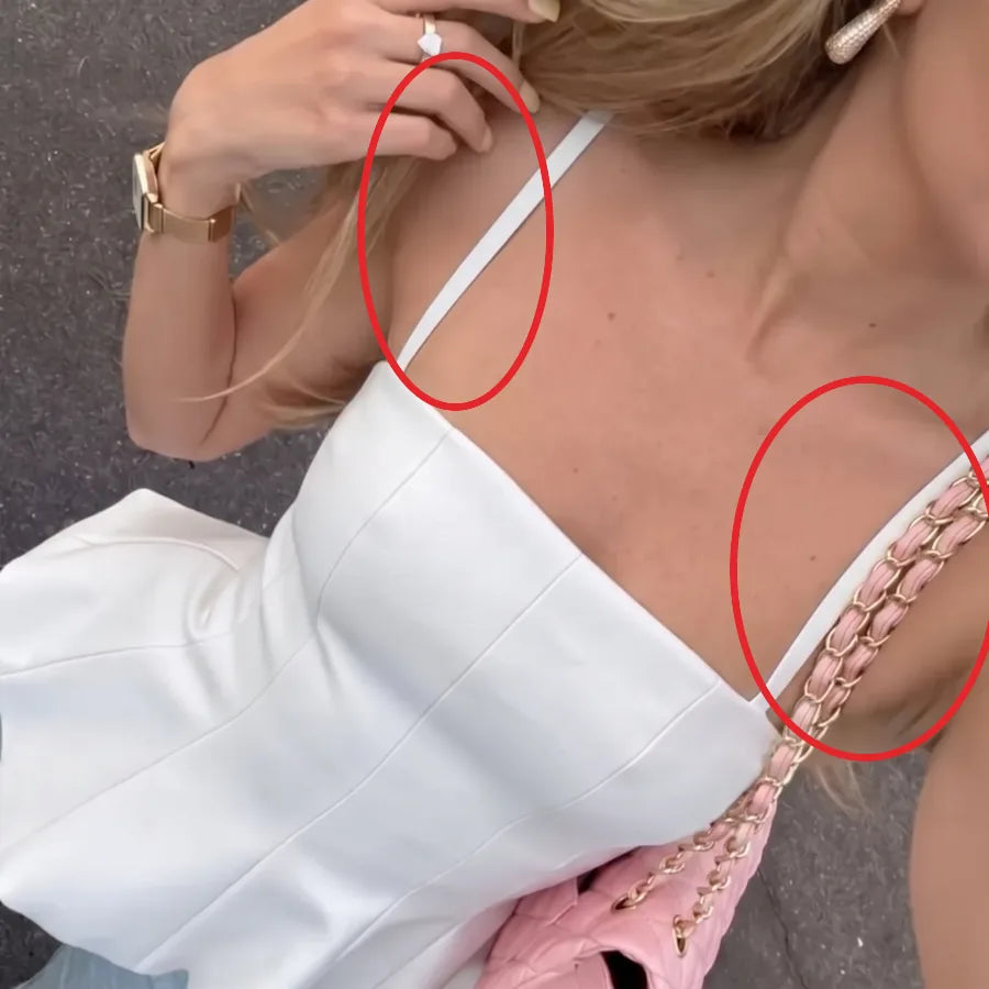 White bra straps showing with a white strapless top